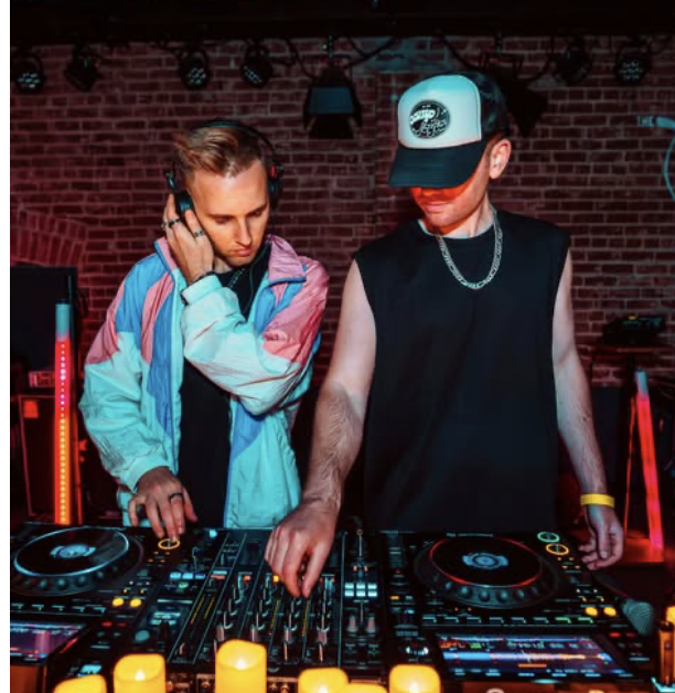 Two DJs mixing at a Casa Nova show